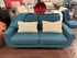 Teal Blue Loveseat With Curved Silhouette Tufted Brown Flared Legs
