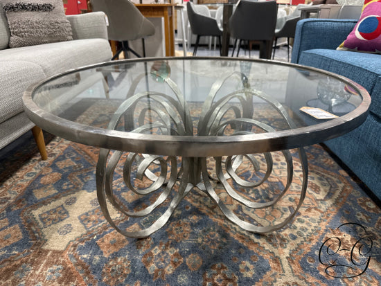 Round Glass Top Coffee Table With Brushed Pewter Finish Metal Trim Swirl Base