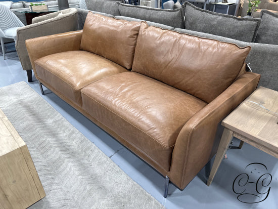 Saddlebag Top Grain Leather Sofa With Loose Back Cushions Polished Metal Legs